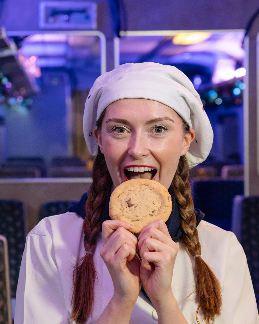 The conductor clipping tickets on THE POLAR EXPRESS™ Train Ride London