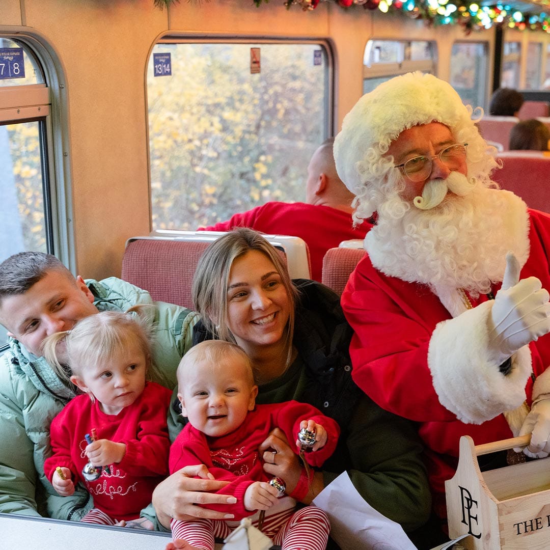 santa and family on board the polar express train ride