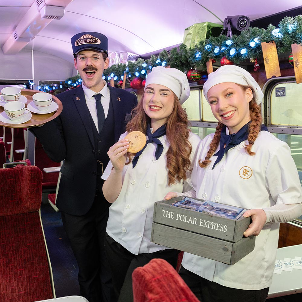 Conductor and chefs on board the polar express train ride