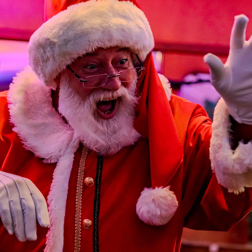 Santa waving on board the polar express train ride