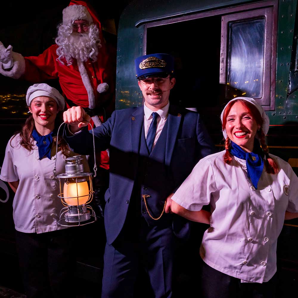 santa chef and conductors at the polar express train ride