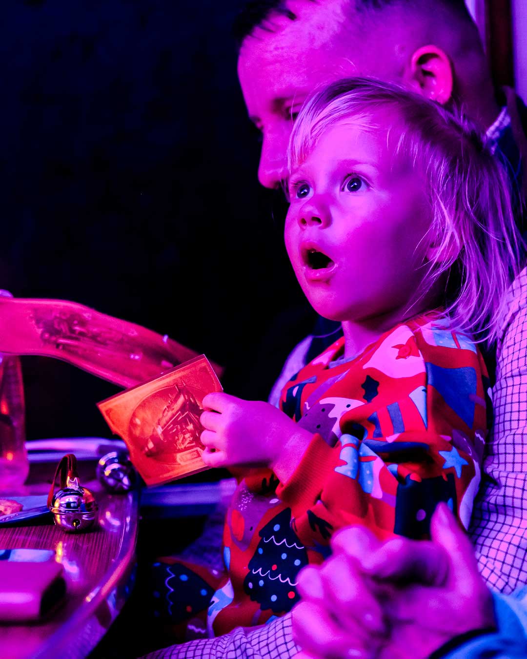 child with ticket on board the polar express train ride
